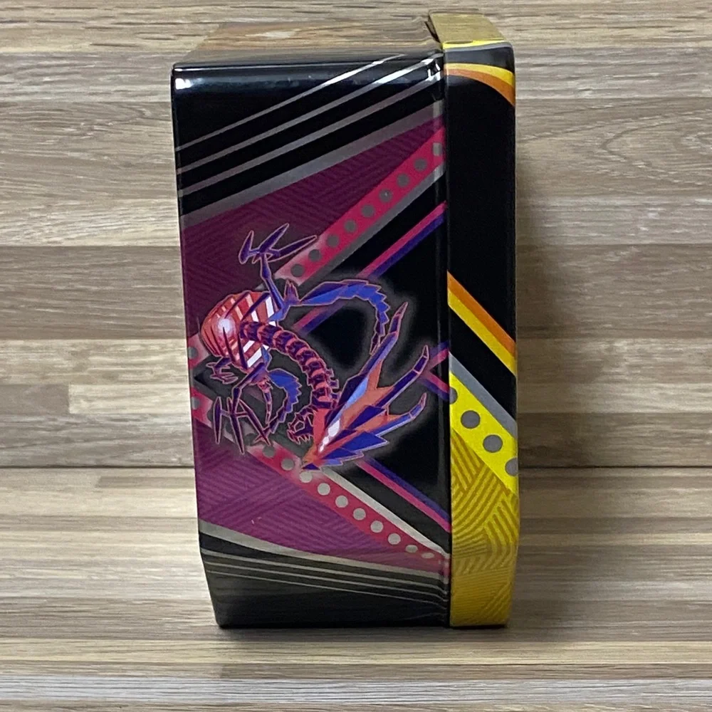 Pokemon Pikachu Yellow and Black Card Tin filled with cards and Pokémon pin